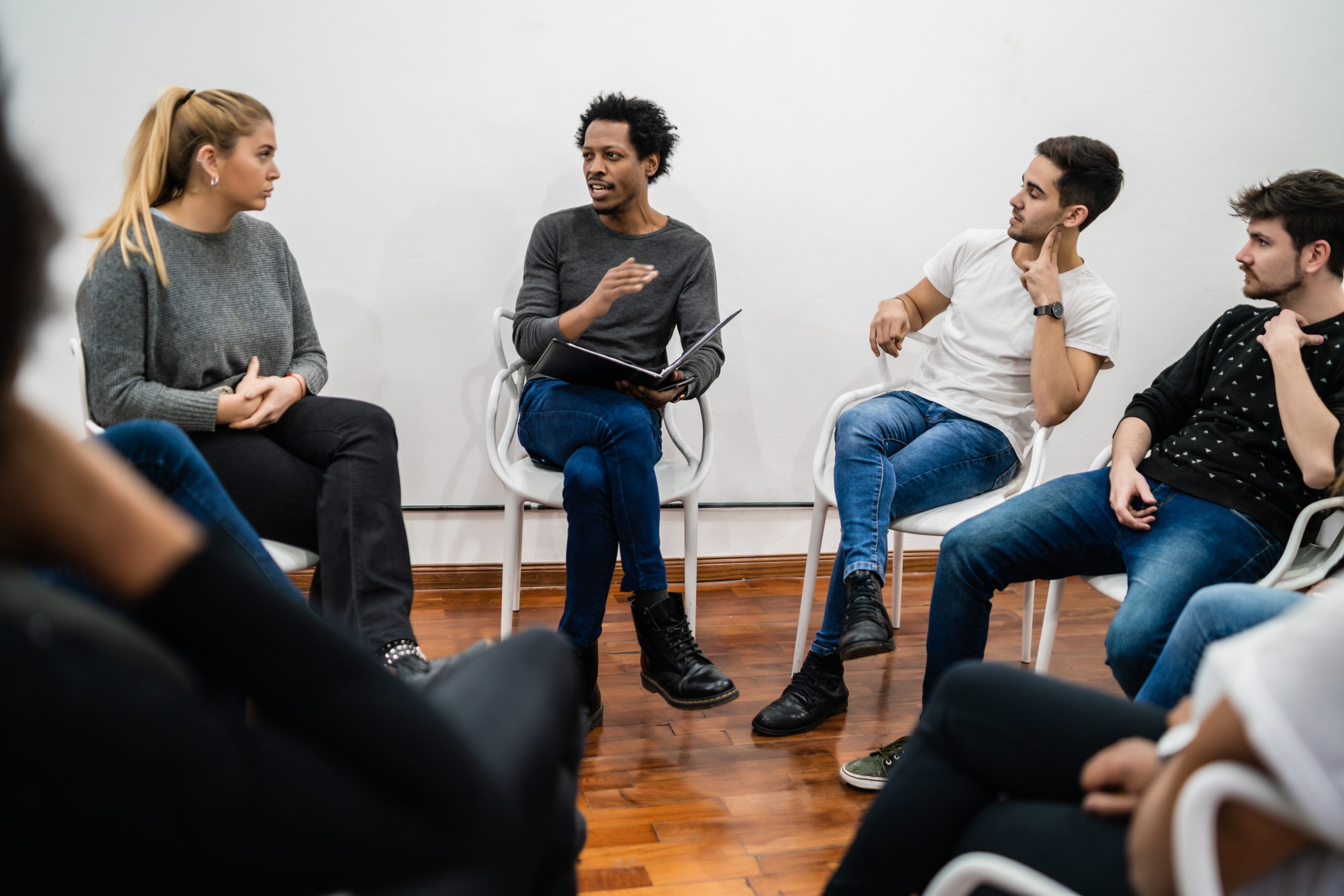 Multiethnic creative people having a brainstorming meeting.